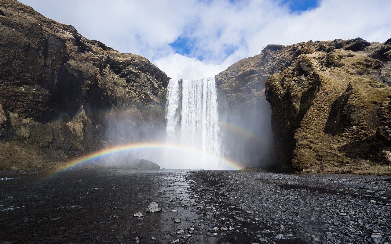A rainbow under Skógafoss waterfall, Iceland