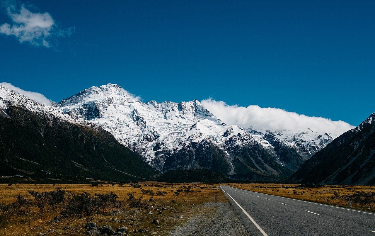 The road to Mount Cook under snow-capped peaks, New Zealand