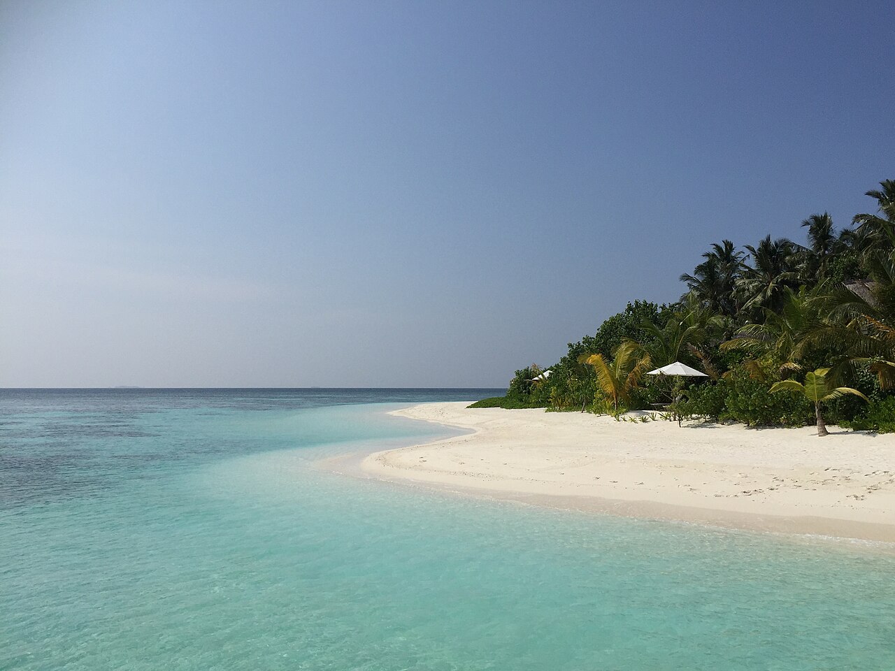 A white beach and turquoise lagoon on a Maldives island