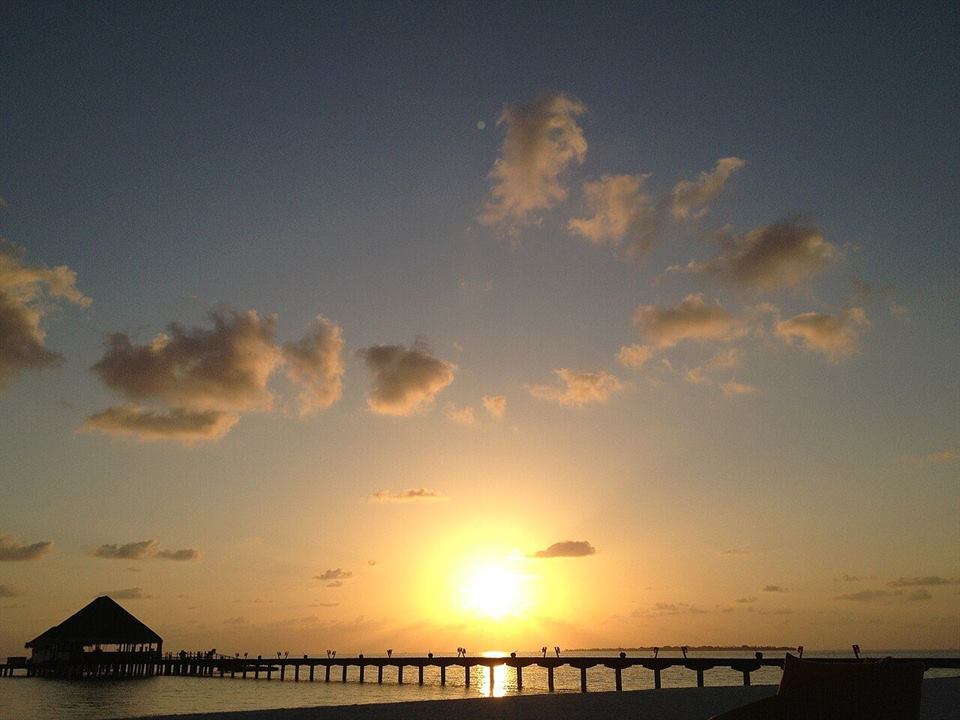 Sunset over a boat jetty on the Maldivian island of Kanuhura