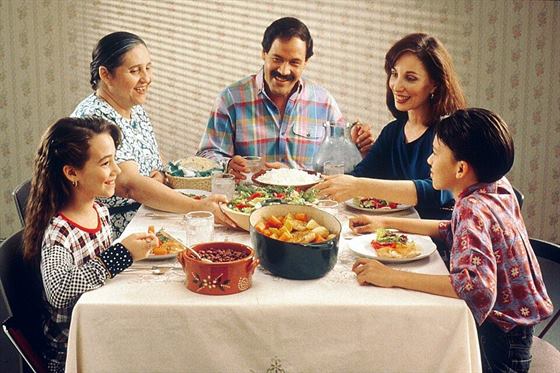 Three generations of a family sharing a meal
