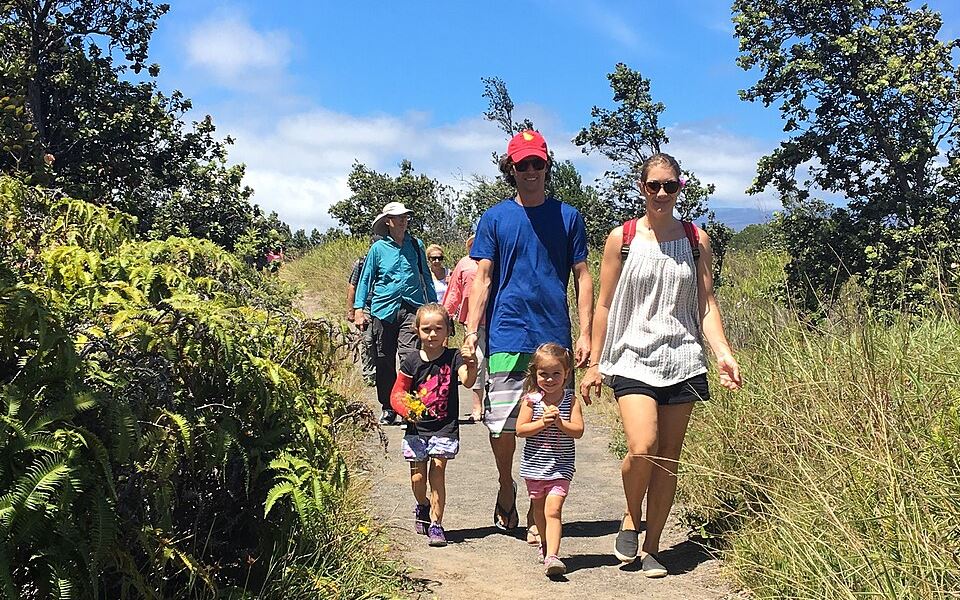 A family hiking a mountain trail