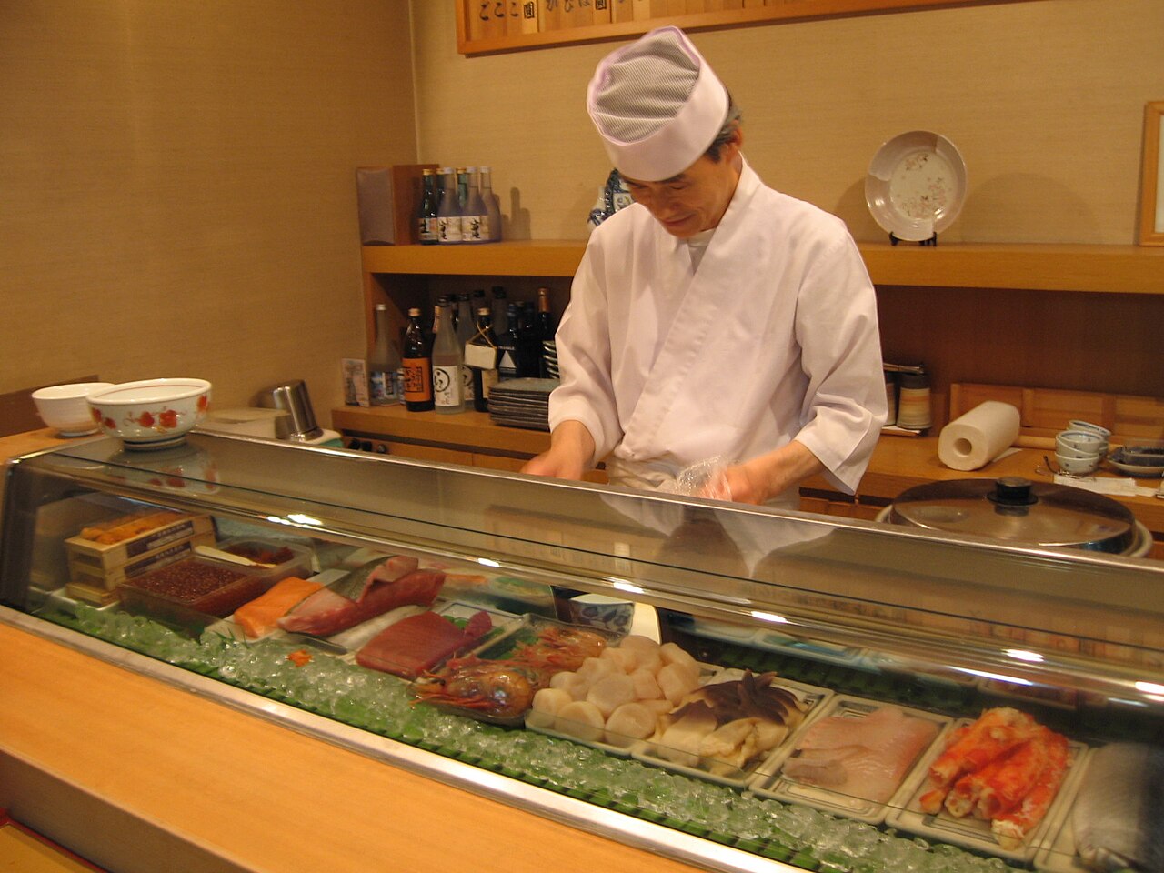 A sushi chef at his counter in Otaru, Japan