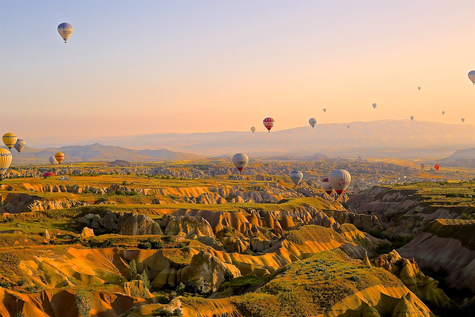 Hot-air balloons over Cappadocia at sunrise