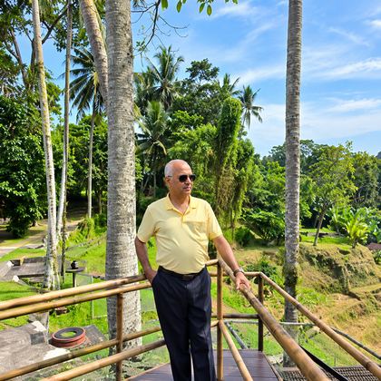 Our traveller on a bamboo deck above the Bali jungle