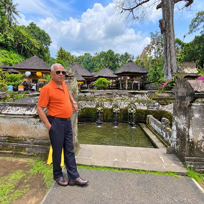 Our traveller beside the spring pools of a Bali temple