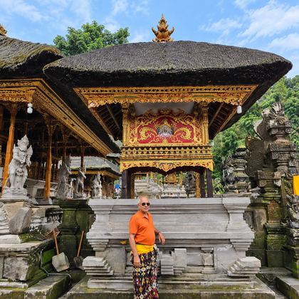 Our traveller in a sarong at a Bali temple pavilion