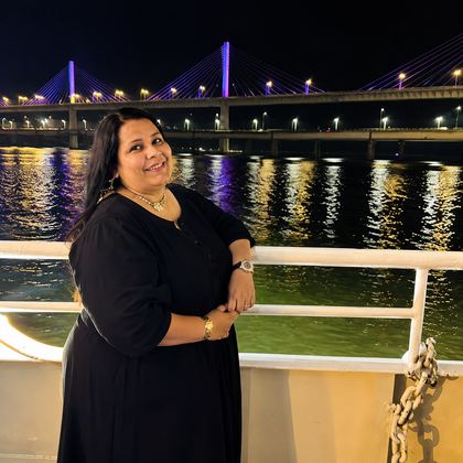 Our traveller on an evening river cruise in Goa